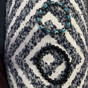 evil eye and black stretch bracelets